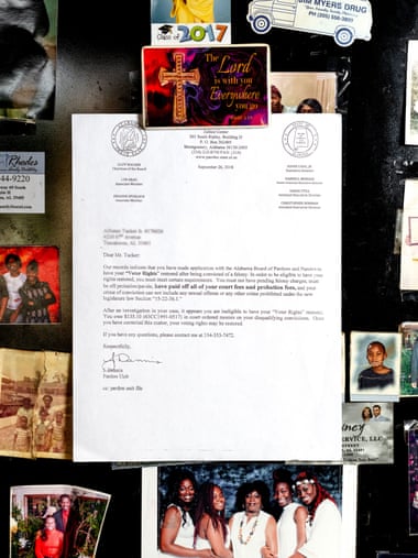 A letter hangs on Alfonzo Tucker’s refrigerator stating that his right to vote has been revoked. Photograph: Johnathon Kelso/The Guardian